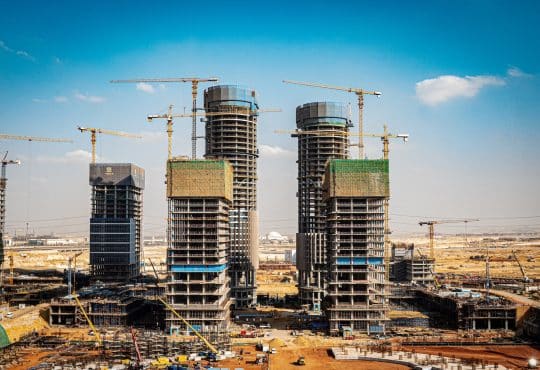a group of tall buildings under construction